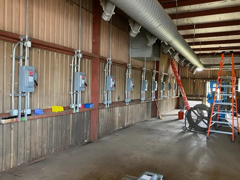 240V welder plug stations and disconnects on interior wall of commercial welding shop in San Marcos TX